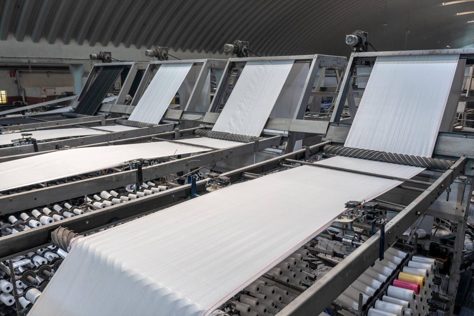 Extrusion coating and fabric handling
