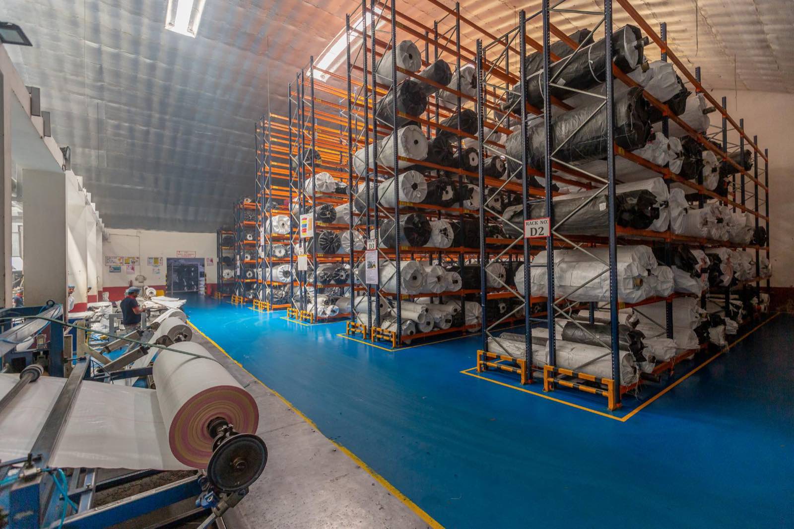 Traceable fabric roll storage alongside the Pegma coating line